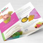 A tri-fold brochure for Pure Gelato on a light wood surface, showcasing images of various gelato flavors with text about ingredients, gluten content, and the differences between ice cream and gelato.