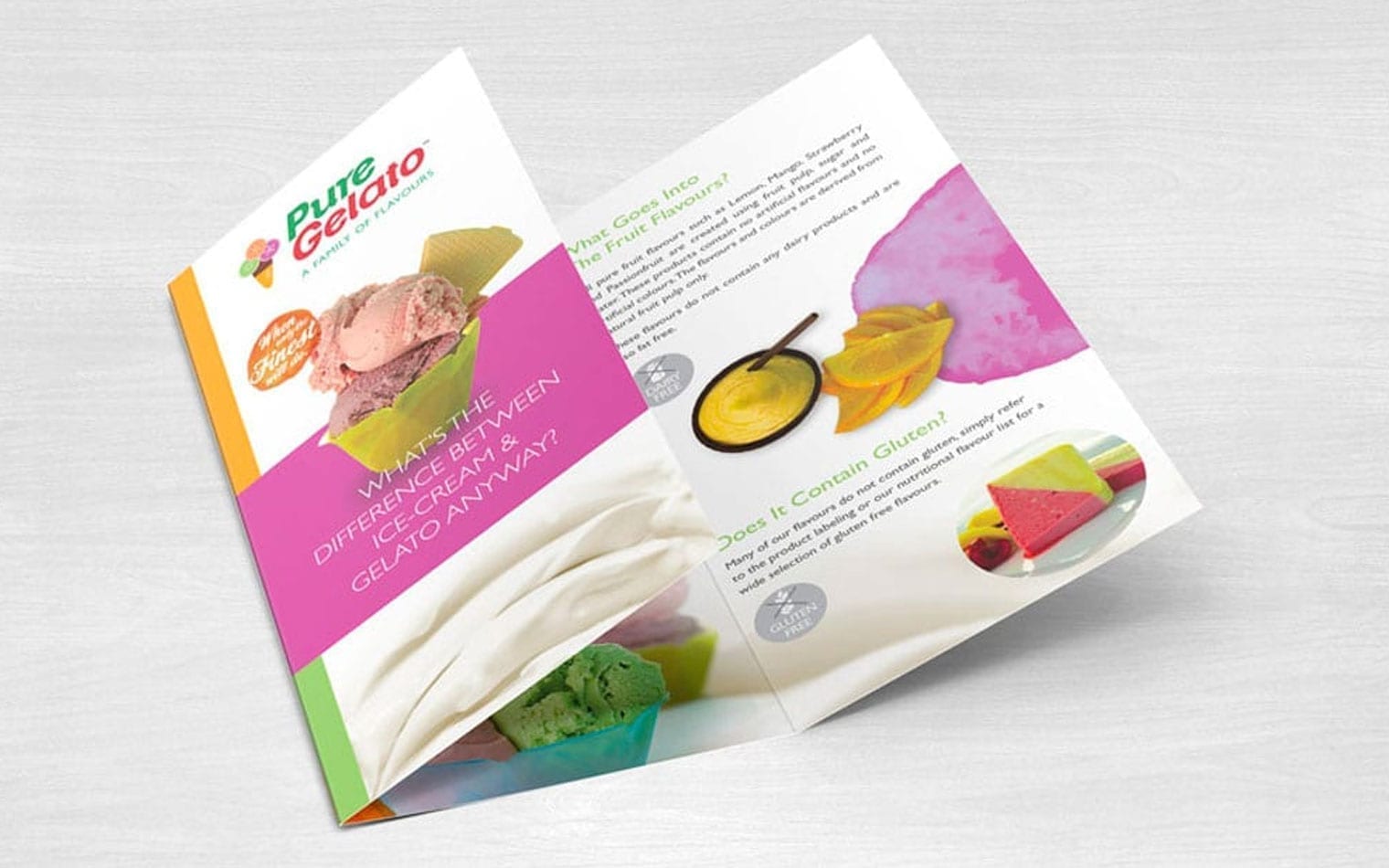 A tri-fold brochure for Pure Gelato on a light wood surface, showcasing images of various gelato flavors with text about ingredients, gluten content, and the differences between ice cream and gelato.