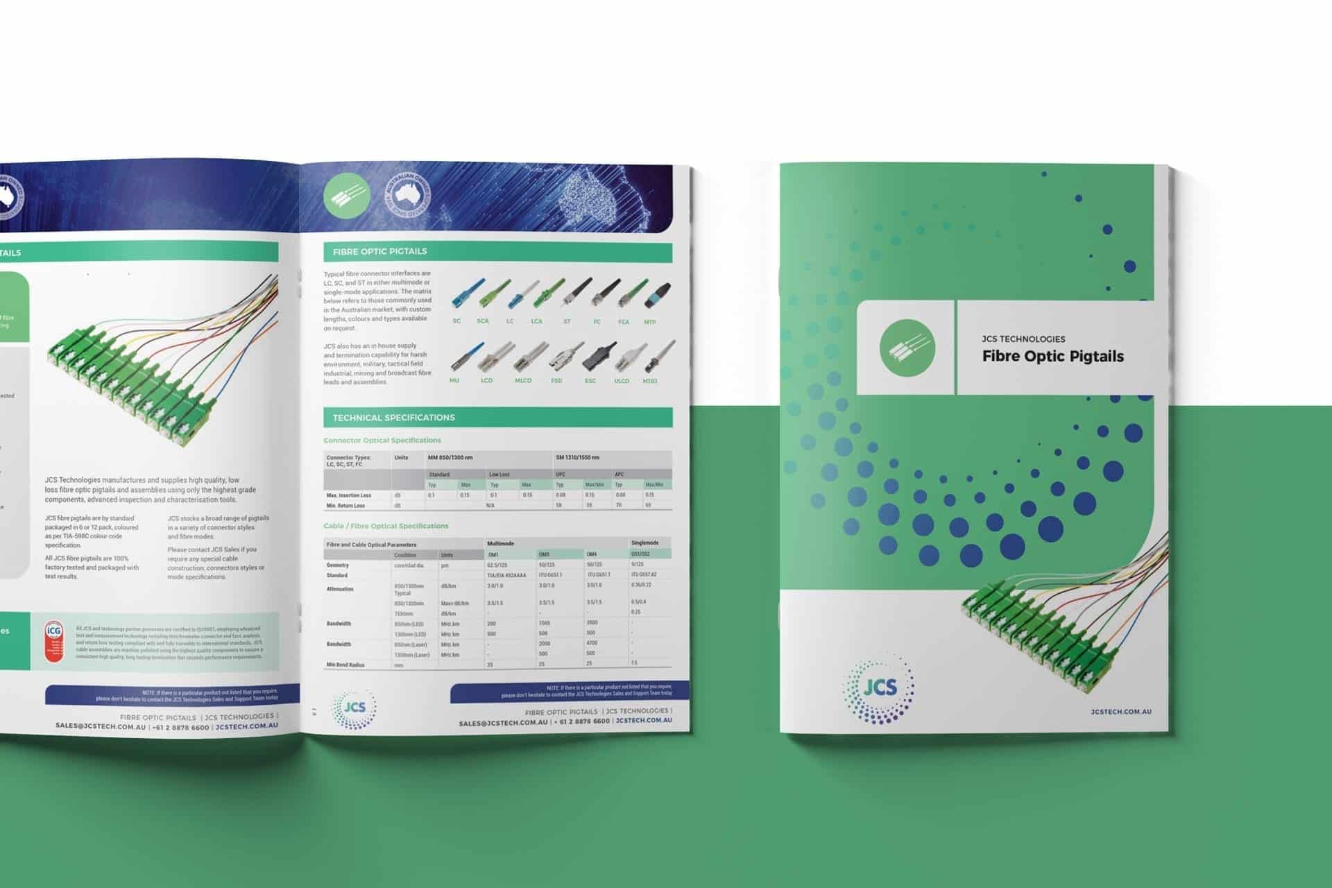Two-page spread showcasing a technical brochure for "Fibre Optic Pigtails" by JCS Technologies. The JCS-branded cover is on the right, featuring a sleek green and blue design, while detailed technical information is displayed on the left.