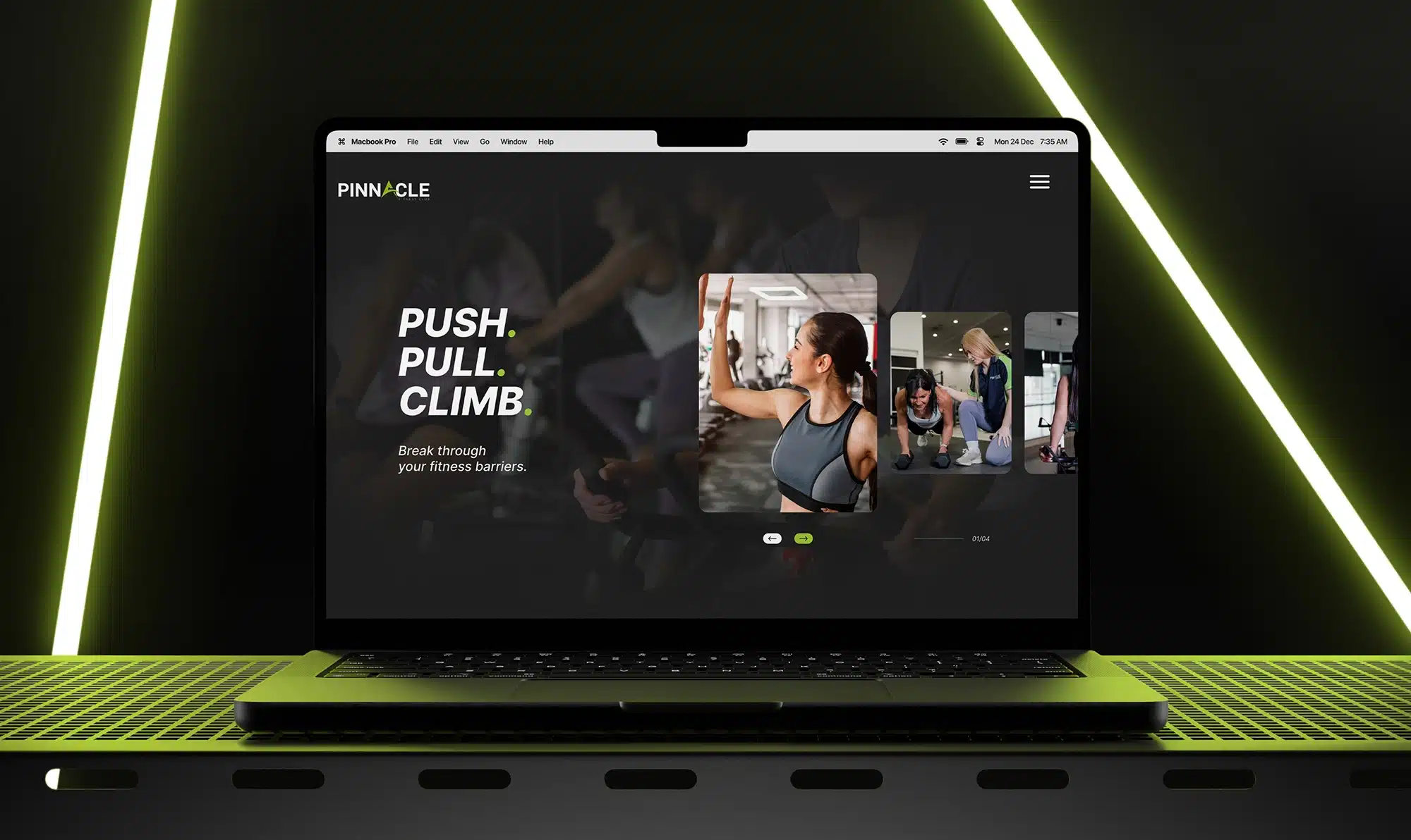A laptop displaying a fitness website with the text "Push. Pull. Climb." and images of people exercising. The laptop, set on a perforated grid surface with a black and green color scheme, epitomizes the pinnacle of workout motivation and digital design.