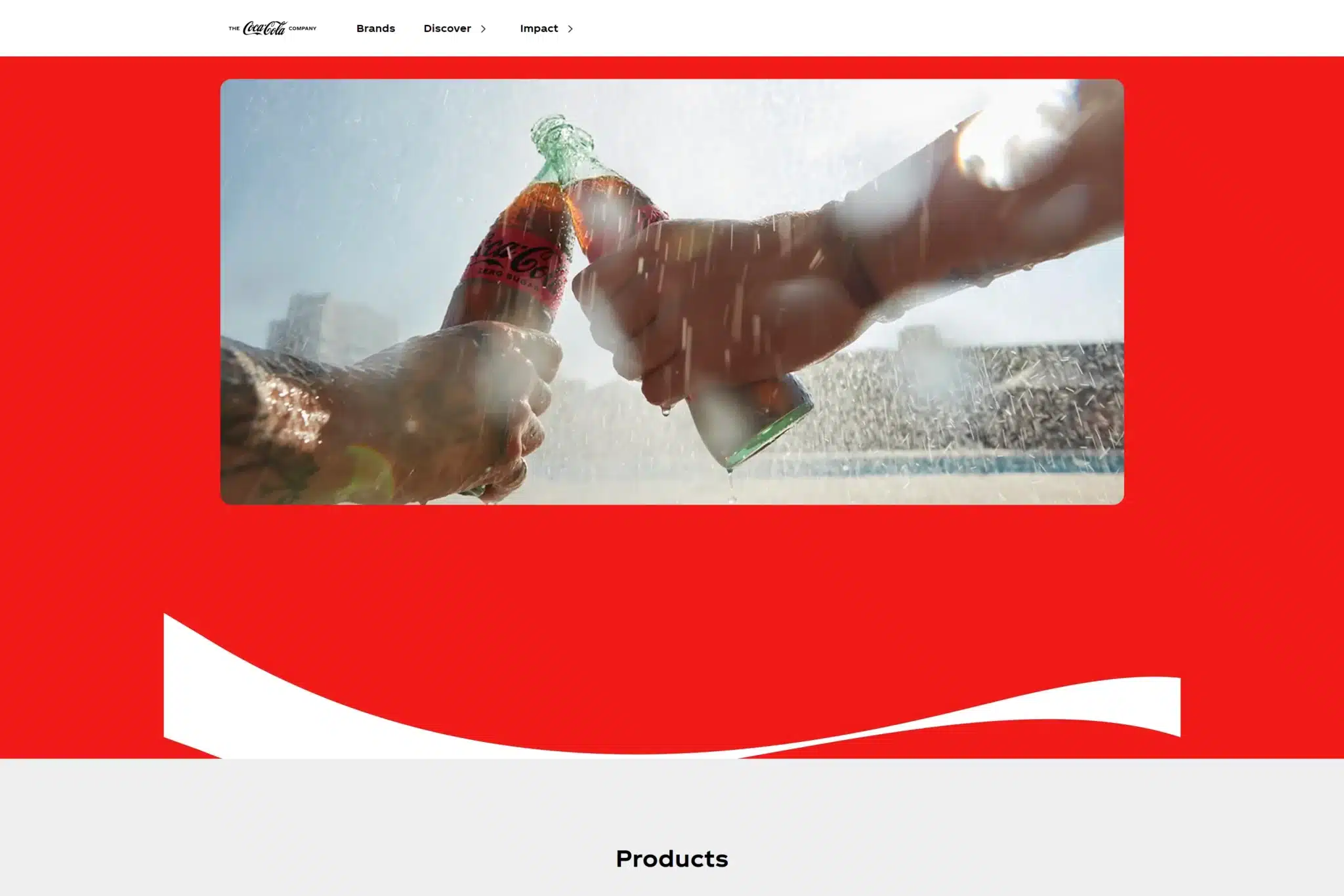 Two hands clinking Coca-Cola bottles in front of a water splash backdrop, viewed on a website with a predominantly red and white color scheme. The design feels curated by AI prompts for the perfect blend of nostalgia and excitement.