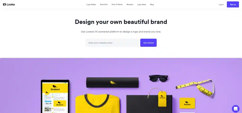 A Looka webpage inviting users to design their own brand using AI prompts. Various branded items like a T-shirt, mug, and business card are displayed against a purple background.