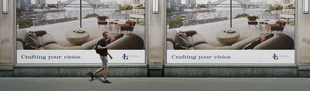 A person walks past two identical large advertisements displaying a modern living room overlooking a harbor, with the text "Crafting your vision" at the bottom of each ad, perfectly capturing the essence of brand development.