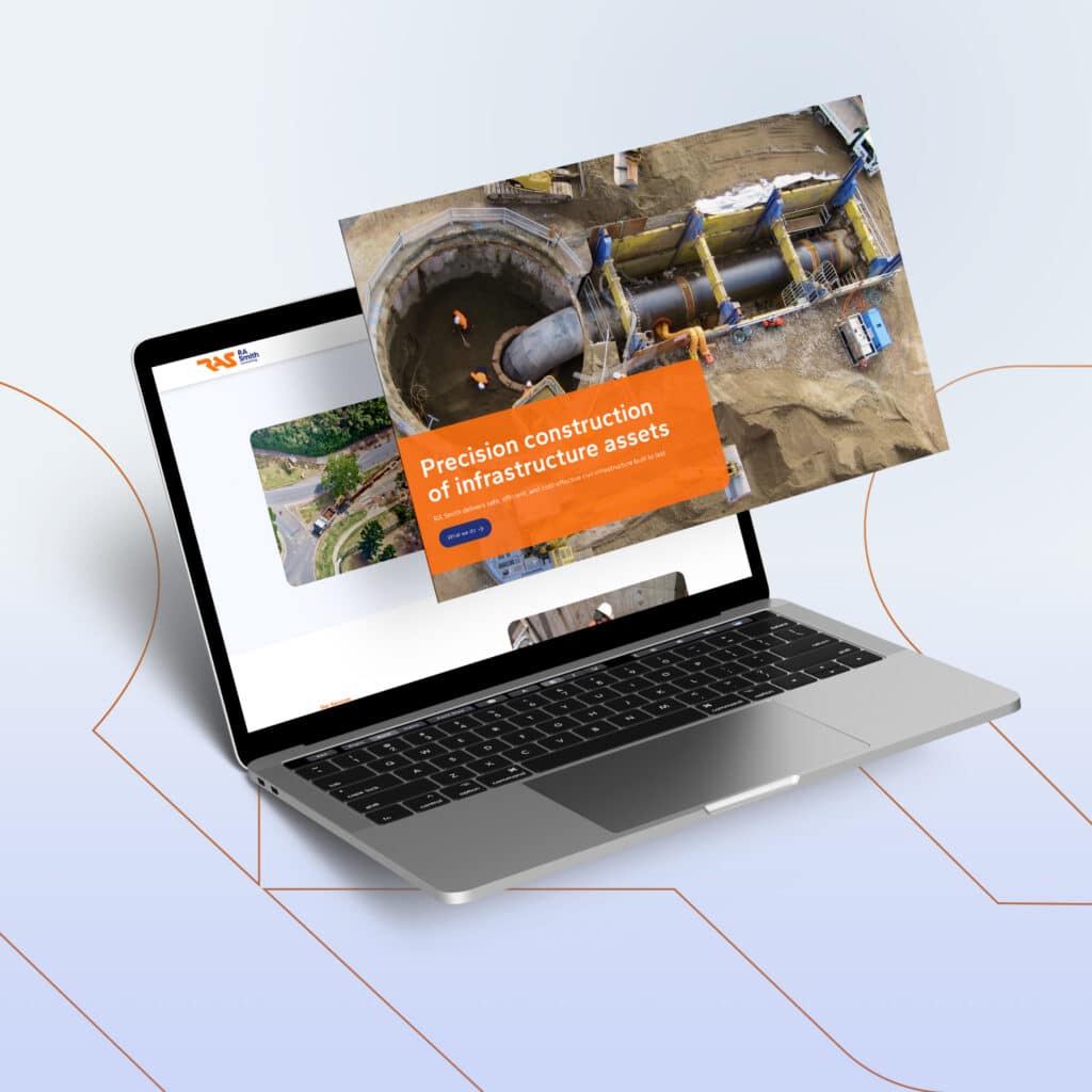 A laptop displays a website, while an image of a construction site with workers and machinery hovers above the screen, reflecting RA Smith’s future-ready approach to brand transformation.