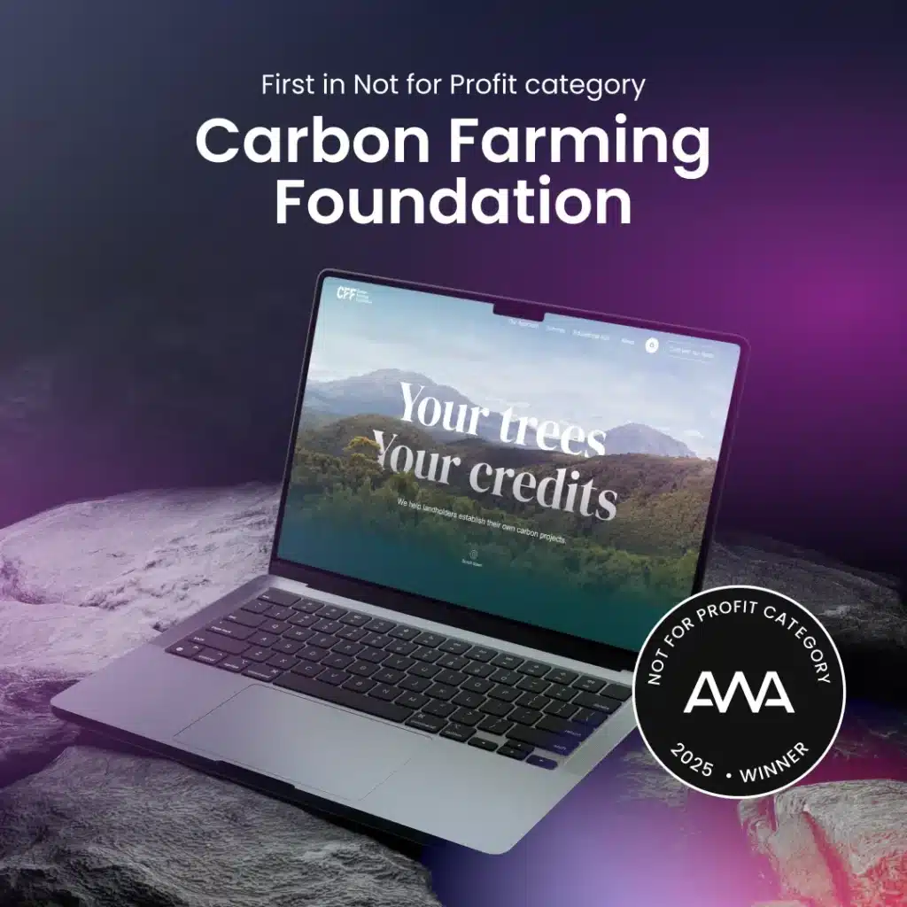 A laptop displays the Carbon Farming Foundation website; a badge reads "Not For Profit Category, 2025 Winner, AVA Awards," reflecting recognition at Spark Interact’s Australian Web Award 2025.