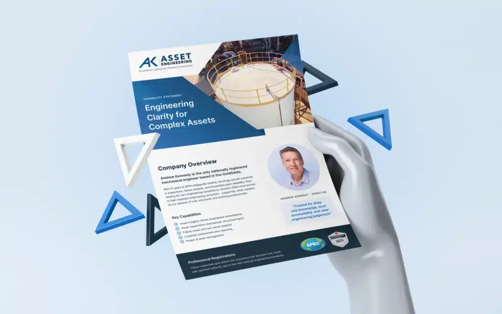 A hand holds a company brochure for Asset Engineering, featuring an industrial tank image, company overview, key capabilities, and a photo of a director identified as a BHP Veteran.