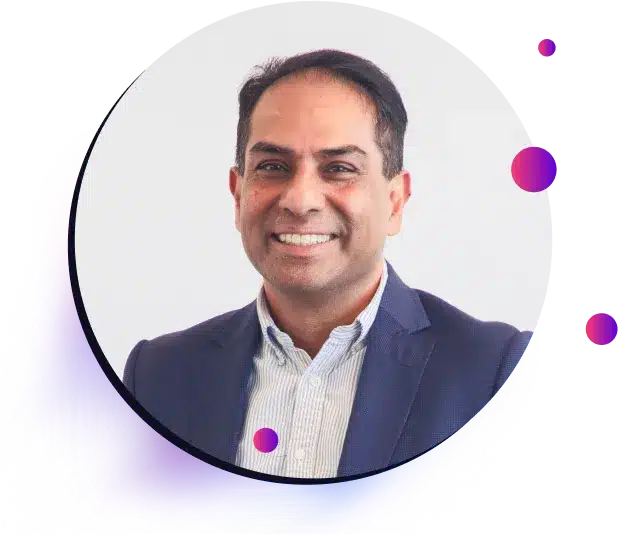 A man in a business suit smiles at the camera, set against a white background with colorful digital graphic elements around the image border, promoting the upcoming Capability Webinar.