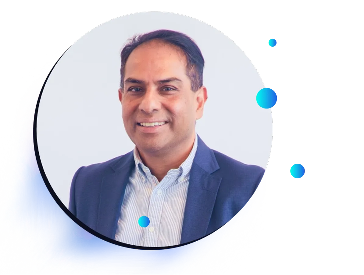 A man wearing a navy blazer and light-colored shirt smiles at the camera against a white background with blue abstract graphic elements, promoting a webinar focused on closing the perception gap.