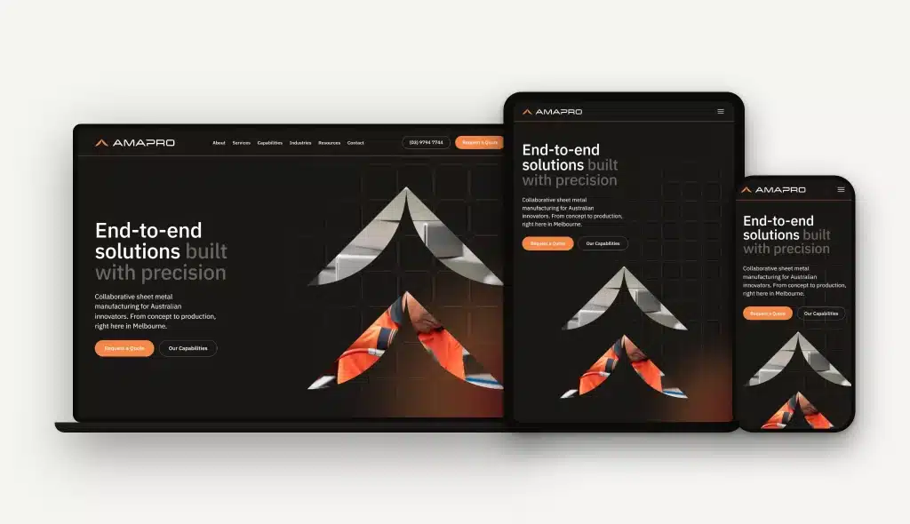 A responsive website for Amapro, a precision manufacturer, is displayed on a laptop, tablet, and smartphone—all showing the homepage with the text "End-to-end solutions built with precision," highlighting an elevated brand experience across every device.