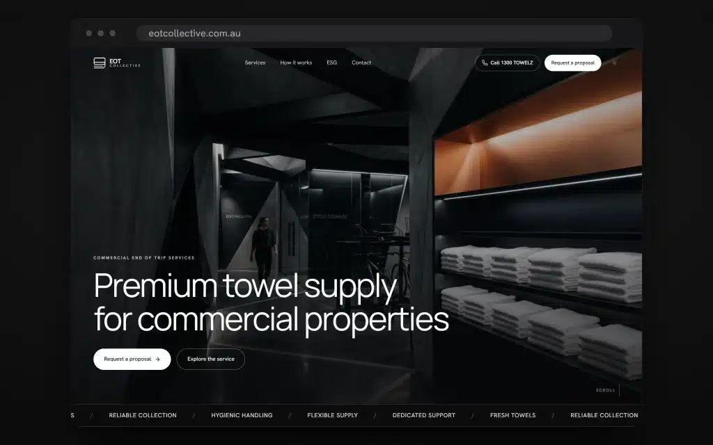 Website homepage for a towel supply company, showcasing the EOT Collective’s digital presence with neatly stacked white towels on shelves in a modern, dark-lit commercial storage area that reflects precision and professionalism.